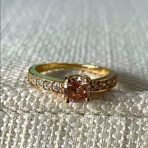 One-size ring gold color and stone.  Stainless steel